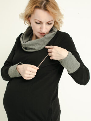 Pregnant woman in breastfeeding dress.