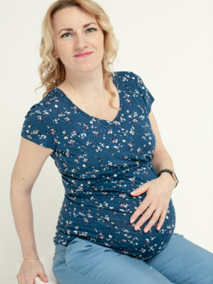 Woman in maternity and breastfeeding blouse.